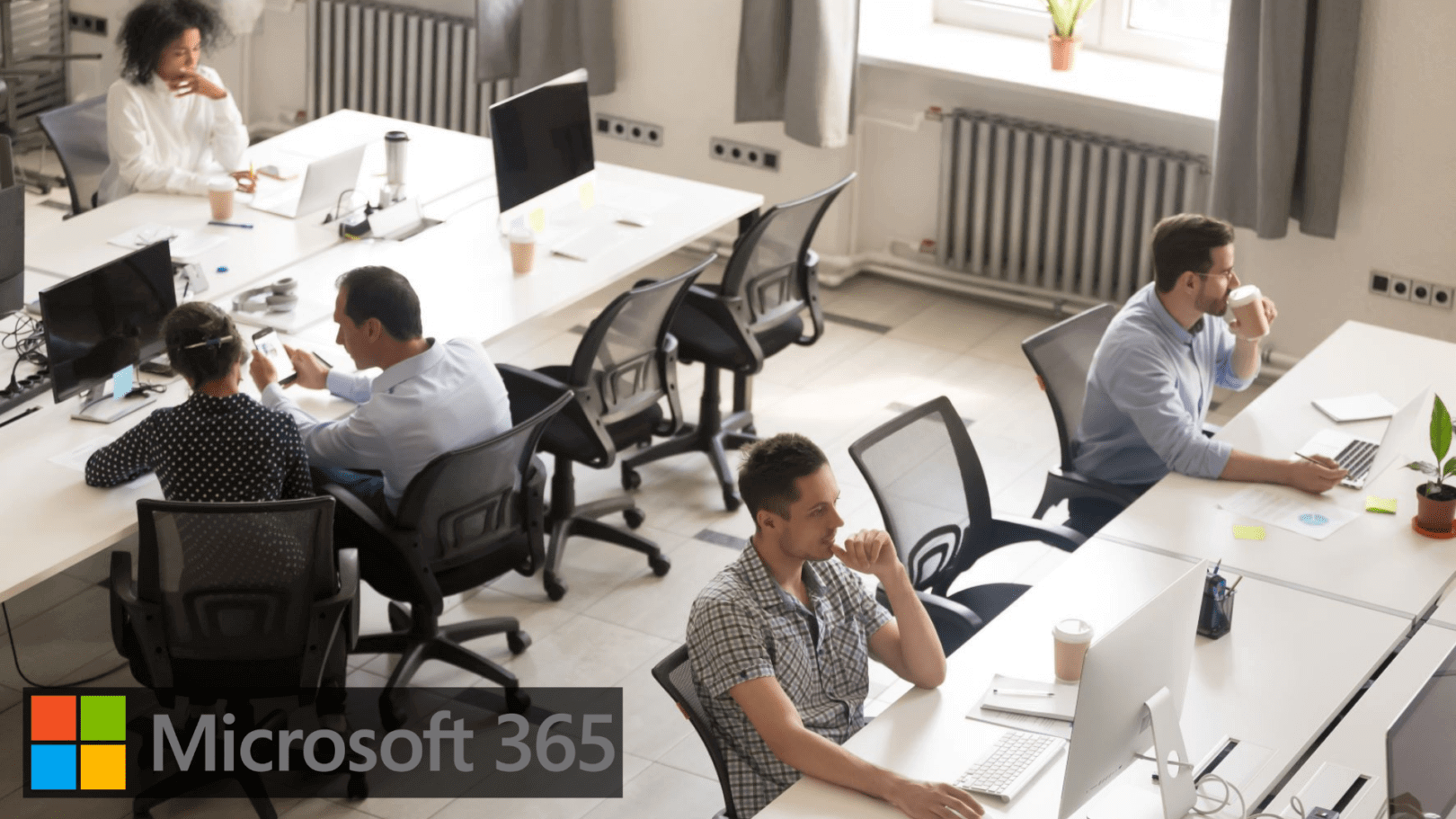 Photo of people working in office with Microsoft 365 logo