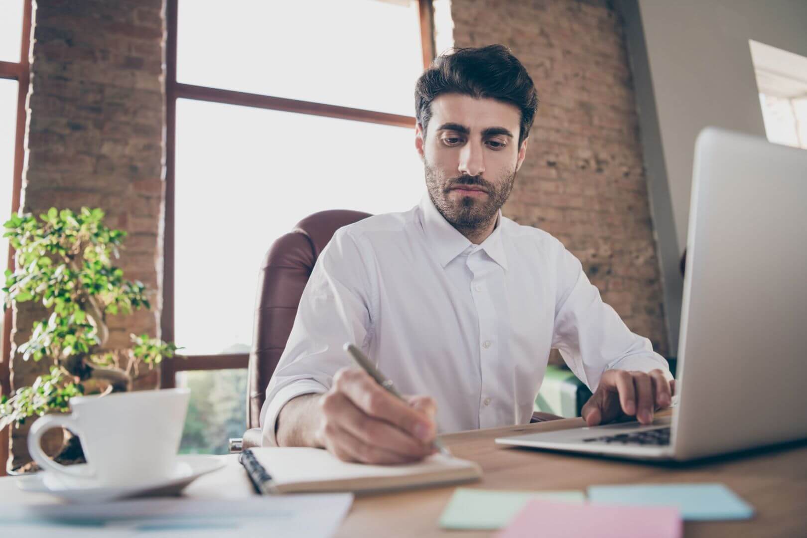 Photograph of man working at desk