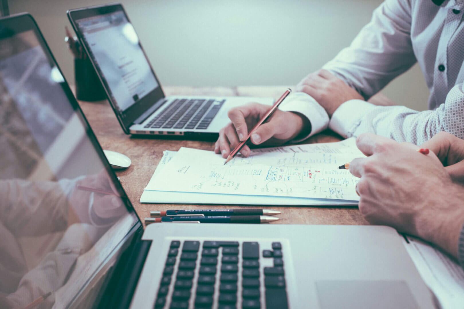 IT support professional assisting users with technical issues in a modern office environment