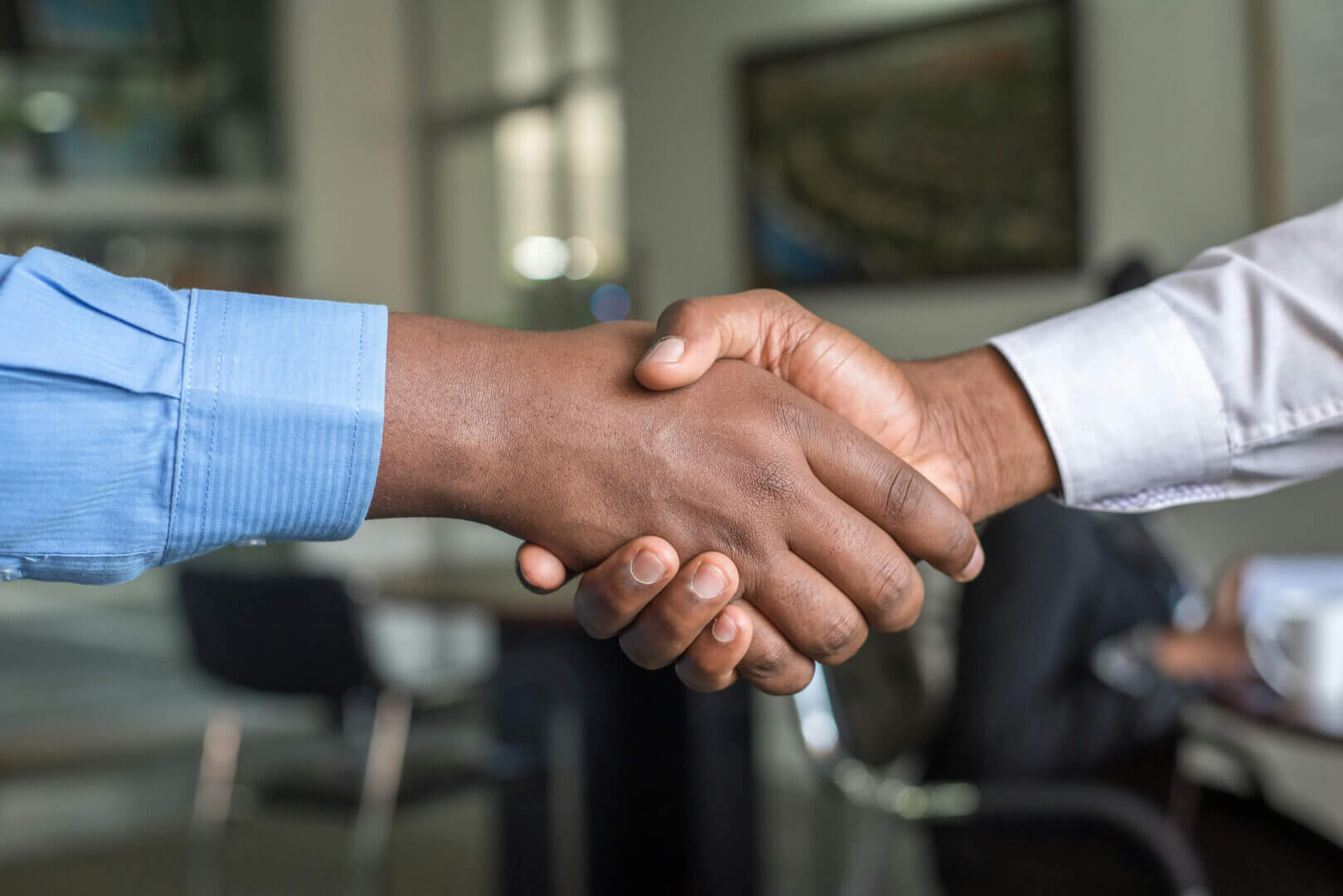 Professional partners shaking hands, symbolizing trust and reliable business collaboration