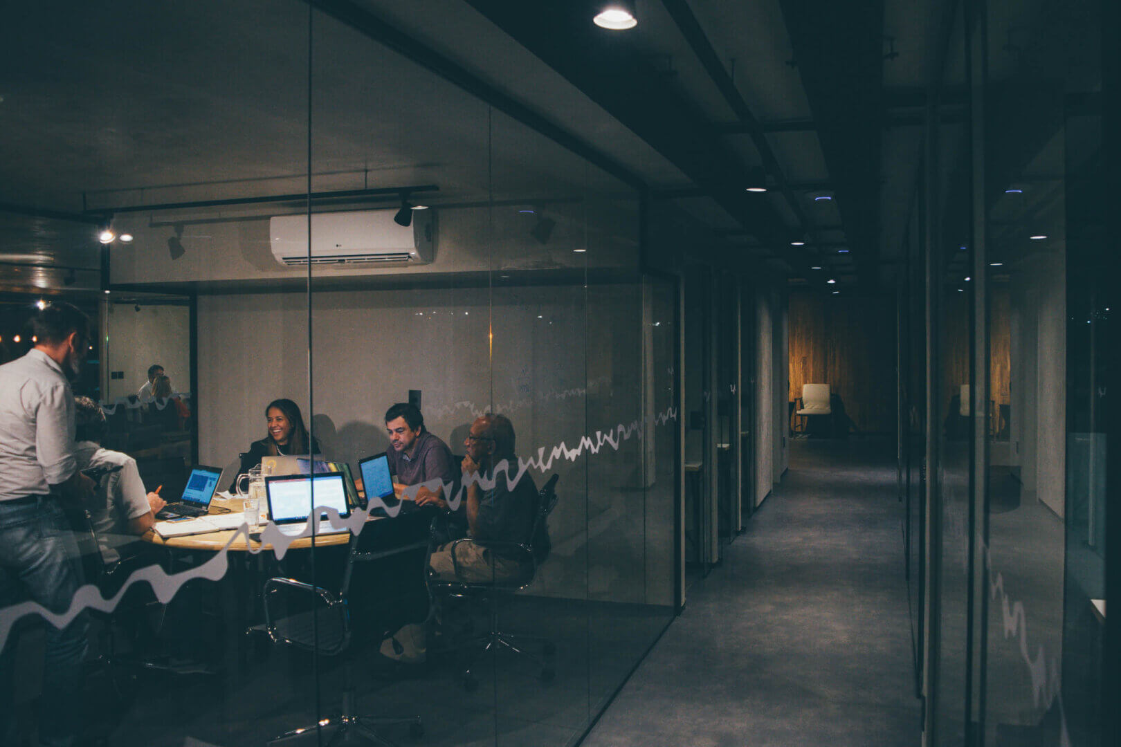 Team of professionals discussing cybersecurity solutions in an office