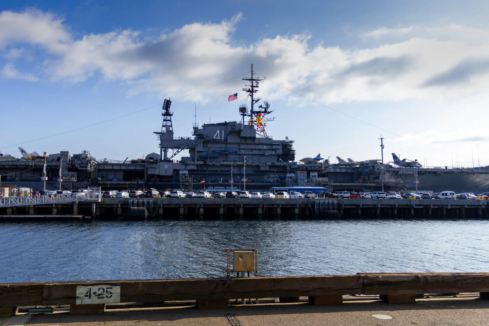 Old naval ships, rusted anchors, or ship components symbolizing past defense operations.