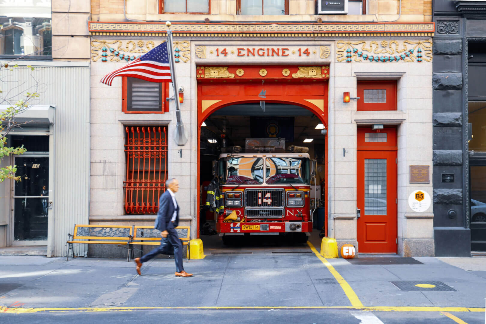 Visitors exploring interactive displays and historical firefighting artifacts.