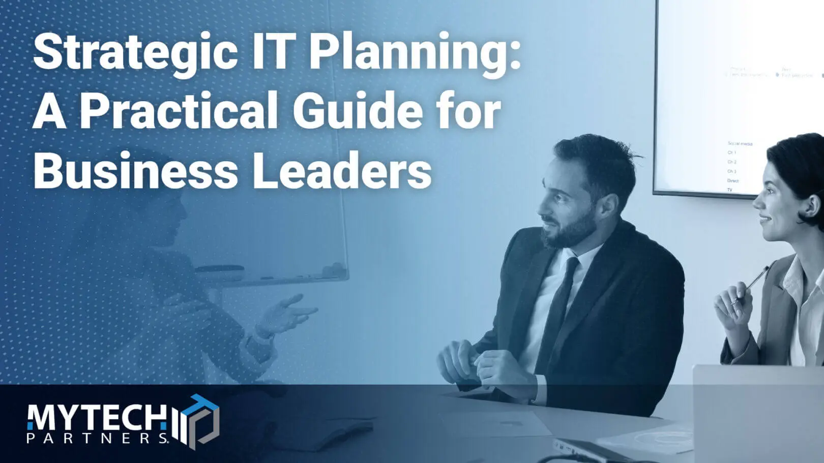 "Blog banner titled 'Strategic IT Planning: A Practical Guide for Business Leaders' from Mytech Partners, showing a duotone blue photo of a businessman and businesswoman talking in a conference room with a presentation screen and whiteboard in the background.